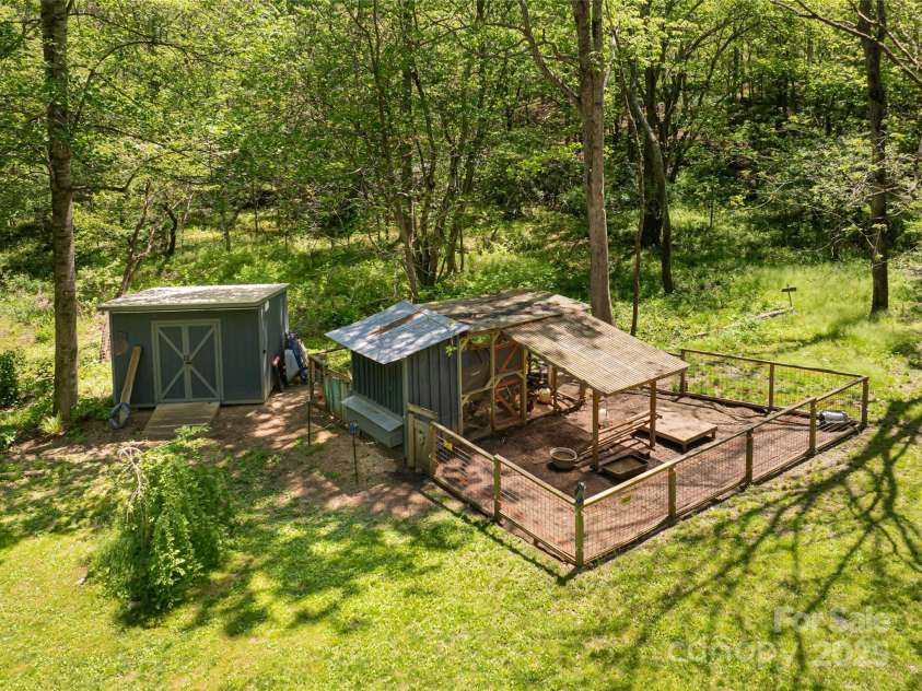 2057 Riceville Road, Asheville, NC 28805.  MLS# CAR4252672, YatesRealty ID 26320. Chicken coop and run