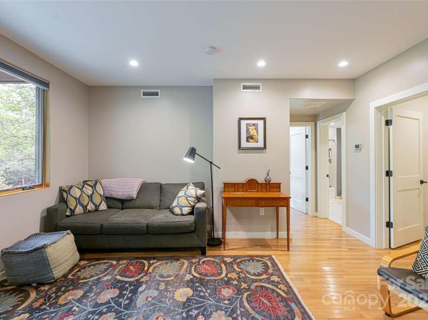 2057 Riceville Road, Asheville, NC 28805.  MLS# CAR4252672, YatesRealty ID 26320. Lower family room