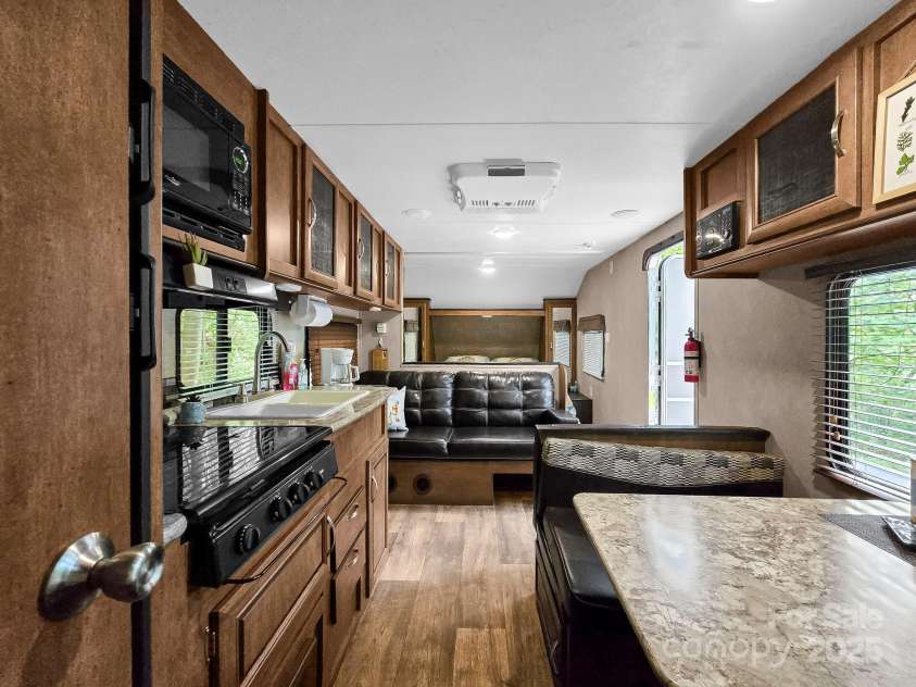 2430 2434 Mountain Page Road, Saluda, NC 28773.  MLS# CAR4276015, YatesRealty ID 26321. 2016 Wildwood camper