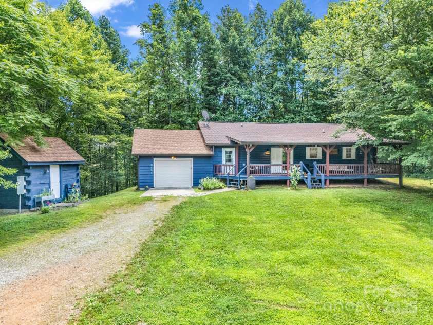 2430 2434 Mountain Page Road, Saluda, NC 28773.  MLS# CAR4276015, YatesRealty ID 26321. 2434 with the well house on the left