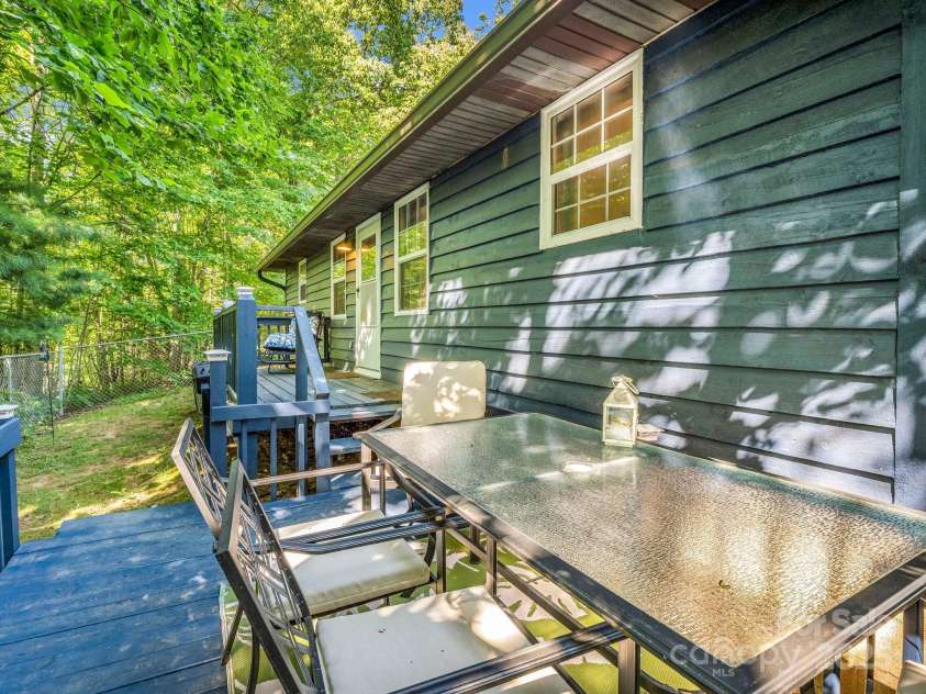 2430 2434 Mountain Page Road, Saluda, NC 28773.  MLS# CAR4276015, YatesRealty ID 26321. Back deck and patio at #2434