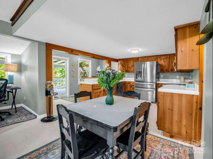 2430 2434 Mountain Page Road, Saluda, NC 28773.  MLS# CAR4276015, YatesRealty ID 26321. Dining area, is open to the kitchen, a study alcove on the left