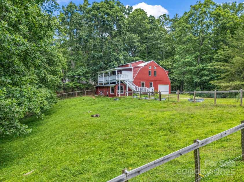 2430 2434 Mountain Page Road, Saluda, NC 28773.  MLS# CAR4276015, YatesRealty ID 26321. Fenced pasture currently used by goats