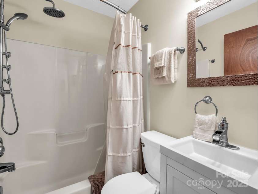 2430 2434 Mountain Page Road, Saluda, NC 28773.  MLS# CAR4276015, YatesRealty ID 26321. Guest bathroom at #2434