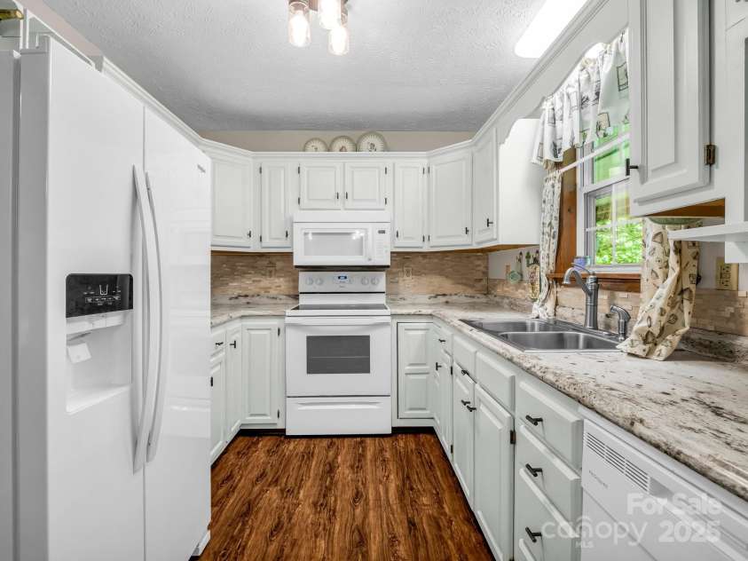 2430 2434 Mountain Page Road, Saluda, NC 28773.  MLS# CAR4276015, YatesRealty ID 26321. Kitchen at #2434