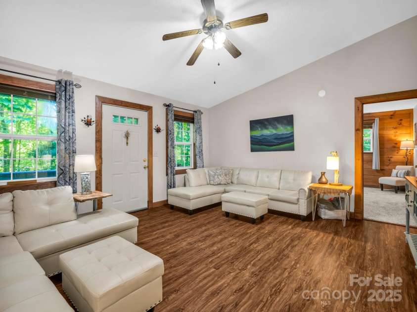 2430 2434 Mountain Page Road, Saluda, NC 28773.  MLS# CAR4276015, YatesRealty ID 26321. Living room - door leads to the deck and patio at #2434