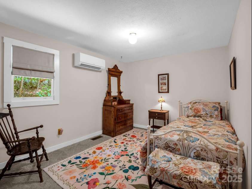 2430 2434 Mountain Page Road, Saluda, NC 28773.  MLS# CAR4276015, YatesRealty ID 26321. Lower level bedroom