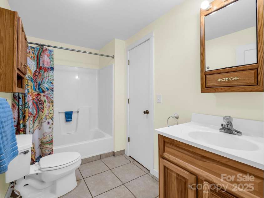 2430 2434 Mountain Page Road, Saluda, NC 28773.  MLS# CAR4276015, YatesRealty ID 26321. Lower level full bathroom