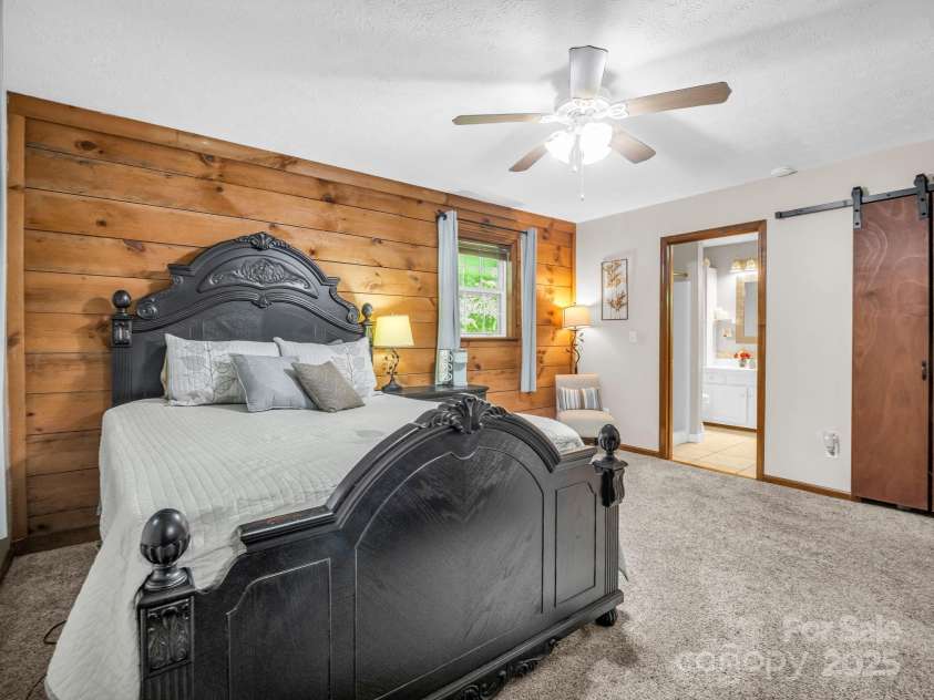 2430 2434 Mountain Page Road, Saluda, NC 28773.  MLS# CAR4276015, YatesRealty ID 26321. Primary bedroom with ensuite bathroom at #2434