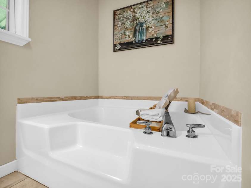 2430 2434 Mountain Page Road, Saluda, NC 28773.  MLS# CAR4276015, YatesRealty ID 26321. Soaking tub in the primary bathroom at #2434
