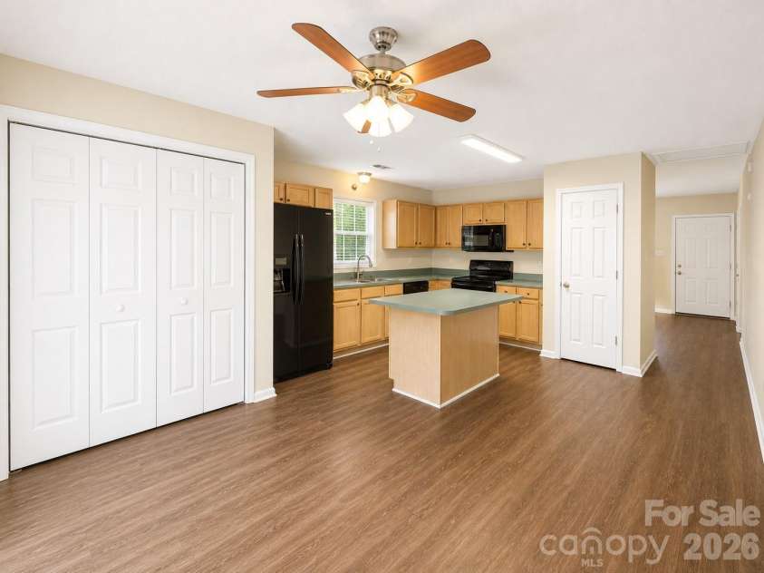 3024 Dairy Farm Drive, Monroe, NC 28110.  MLS# CAR4376209, YatesRealty ID 26326. Kitchen with Island and Pantry