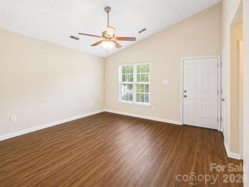 3024 Dairy Farm Drive, Monroe, NC 28110.  MLS# CAR4376209, YatesRealty ID 26326. Living Room with Vaulted Ceiiling