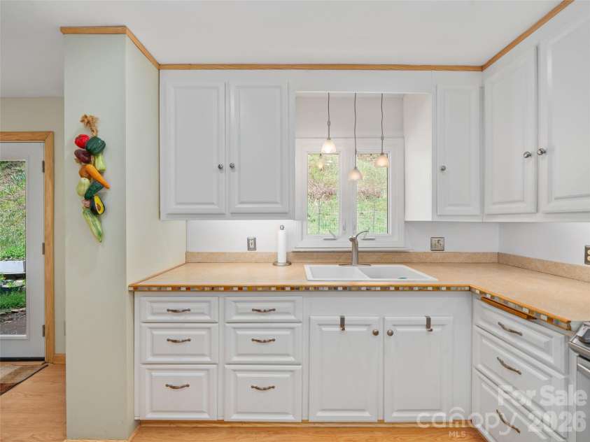 3829 Coxes Creek Road, Burnsville, NC 28714.  MLS# CAR4246043, YatesRealty ID 26331. Large Cabinetry Storage in Kitchen