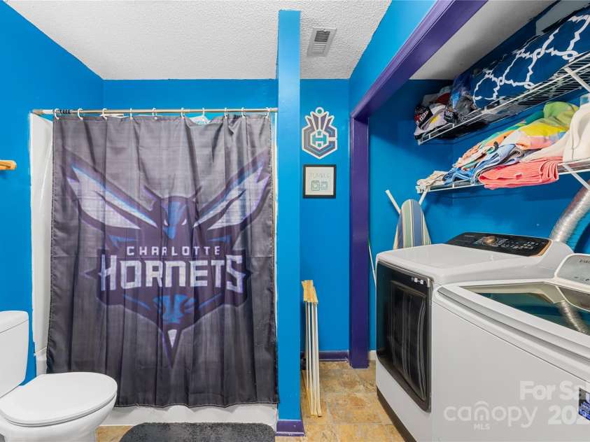 7410 Derby Meadows Court, Charlotte, NC 28216.  MLS# CAR4278987, YatesRealty ID 26335. Laundry in basement bath
