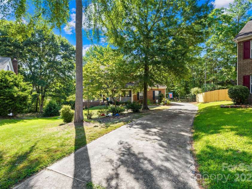 7410 Derby Meadows Court, Charlotte, NC 28216.  MLS# CAR4278987, YatesRealty ID 26335. Lots of extra driveway parking - 2 car side entry garage