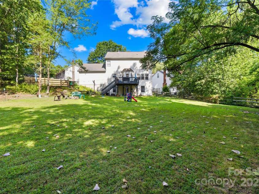 7410 Derby Meadows Court, Charlotte, NC 28216.  MLS# CAR4278987, YatesRealty ID 26335. Very private, deep back yard, 1/2 acre lot - rare find!