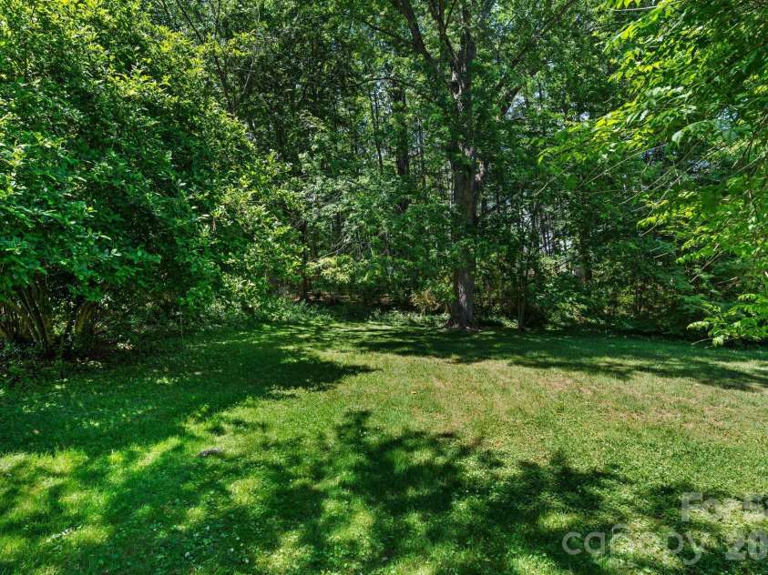 107 Appledore Avenue, Hendersonville, NC 28739.  MLS# CAR4379679, YatesRealty ID 26345. Level backyard easy to maintain.