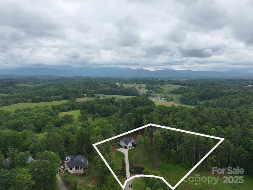 99 Timber Ridge Circle, Leicester, NC 28748.  MLS# CAR4261067, YatesRealty ID 26347. Aerial view of double lot. Lot 95 Timber Ridge  was purchased additionally for privacy. Can be developed for family.@.95 acres