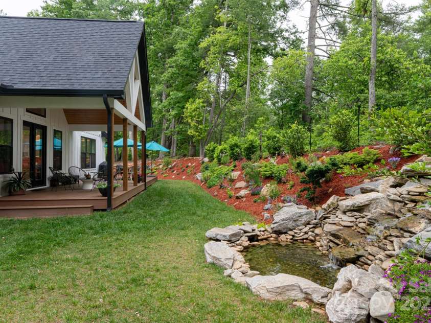 99 Timber Ridge Circle, Leicester, NC 28748.  MLS# CAR4261067, YatesRealty ID 26347. Custom Waterfall and Pond