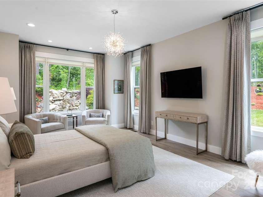 99 Timber Ridge Circle, Leicester, NC 28748.  MLS# CAR4261067, YatesRealty ID 26347. Primary Suite with views of the Waterfall and privacy