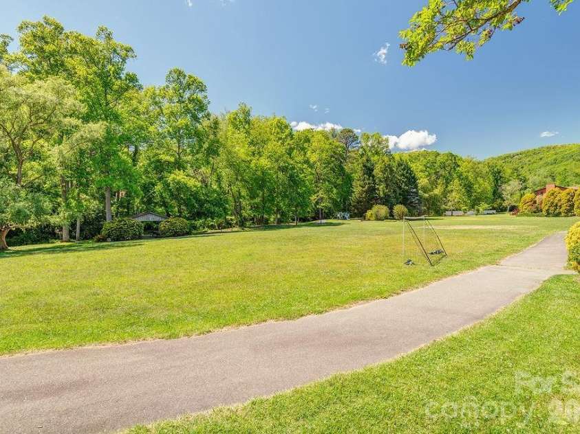 146 Churchill Downs Drive, Fairview, NC 28730.  MLS# CAR4383369, YatesRealty ID 26349. Community park- playing fields, walking trail, playground and...
