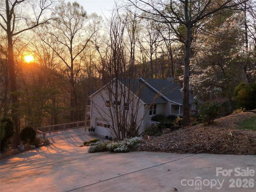 146 Churchill Downs Drive, Fairview, NC 28730.  MLS# CAR4383369, YatesRealty ID 26349. Late winter sunset