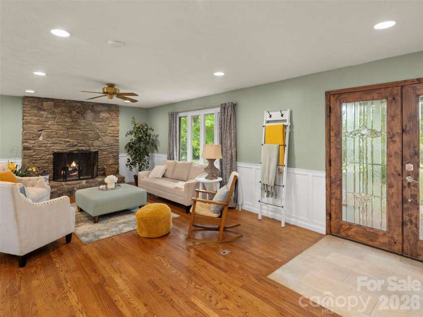 1 Glen Meadows Place, Arden, NC 28704.  MLS# CAR4386745, YatesRealty ID 26350. Floor to ceiling rock fireplace