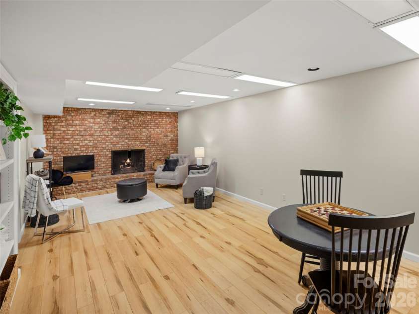 1 Glen Meadows Place, Arden, NC 28704.  MLS# CAR4386745, YatesRealty ID 26350. Spacious den/rec room