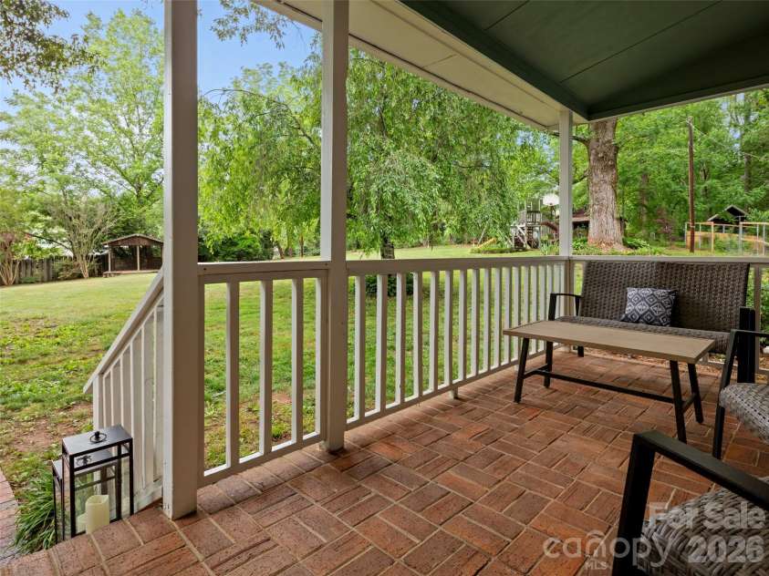 1 Glen Meadows Place, Arden, NC 28704.  MLS# CAR4386745, YatesRealty ID 26350. Tranquil covered front porch