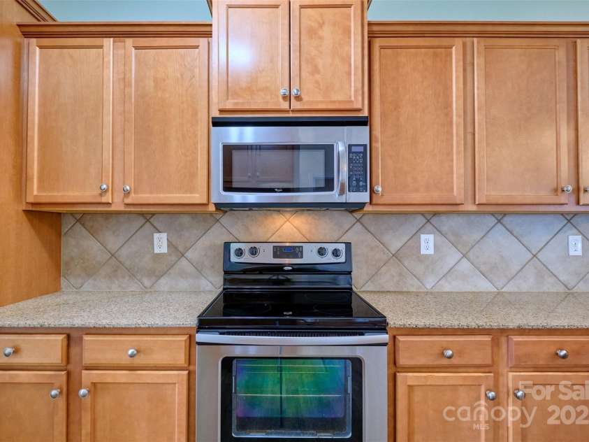 5176 Crystal Lakes Drive, Rock Hill, SC 29732.  MLS# CAR4281097, YatesRealty ID 26352. Stainless appliances and tile backsplash