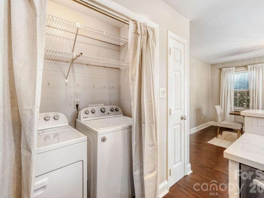 9411 Kings Falls Drive, Charlotte, NC 28210.  MLS# CAR4361281, YatesRealty ID 26352. Laundry Closet in Kitchen
