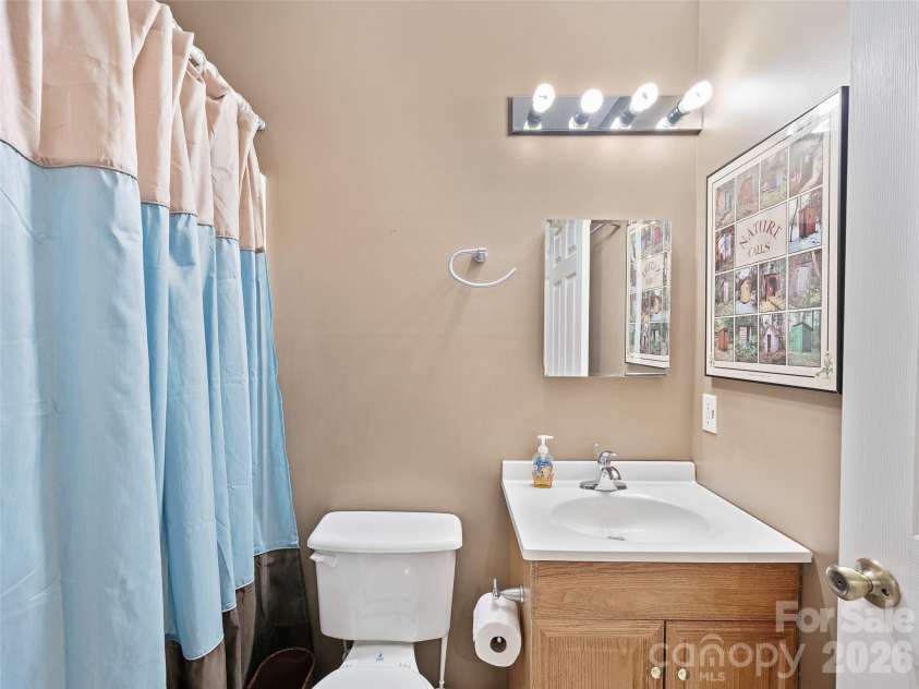 142 Wildflower Road, Spruce Pine, NC 28777.  MLS# CAR4384771, YatesRealty ID 26353. Downstairs Covered Deck