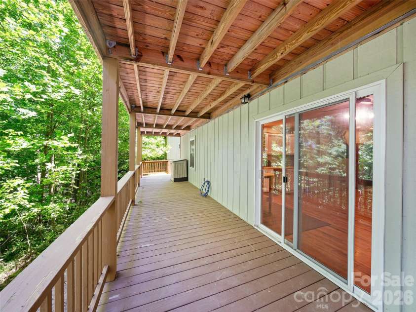 142 Wildflower Road, Spruce Pine, NC 28777.  MLS# CAR4384771, YatesRealty ID 26353. Downstairs Covered Deck