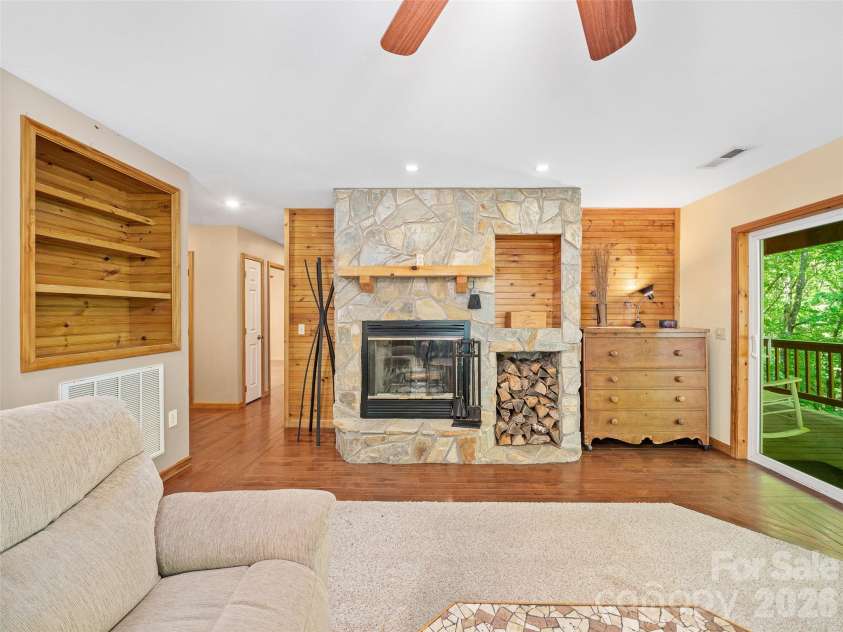142 Wildflower Road, Spruce Pine, NC 28777.  MLS# CAR4384771, YatesRealty ID 26353. Living Room with Wood Burning Fireplace