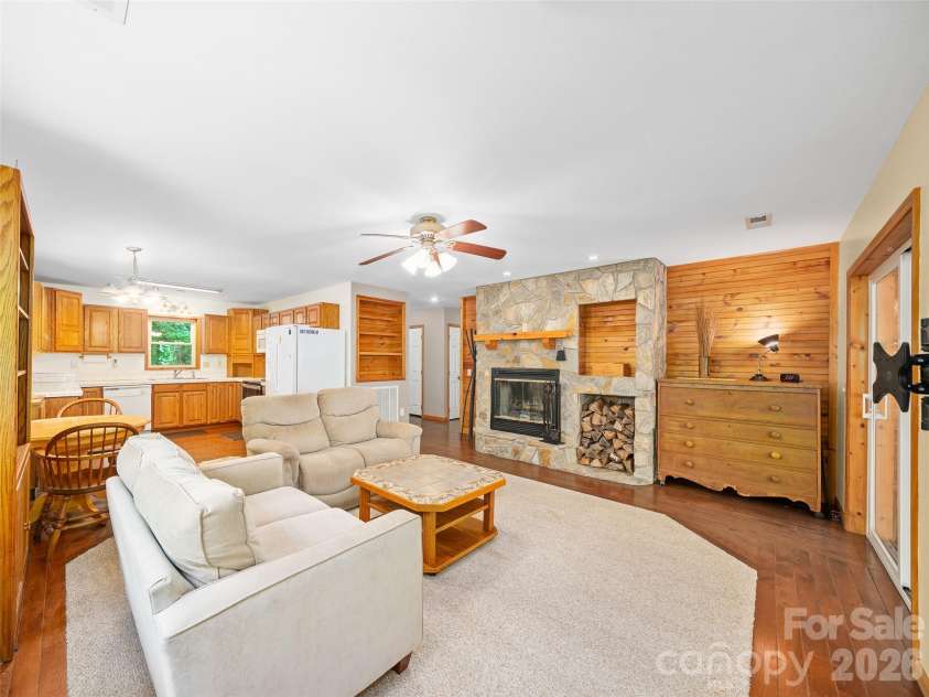 142 Wildflower Road, Spruce Pine, NC 28777.  MLS# CAR4384771, YatesRealty ID 26353. Living Room with Wood Burning Fireplace