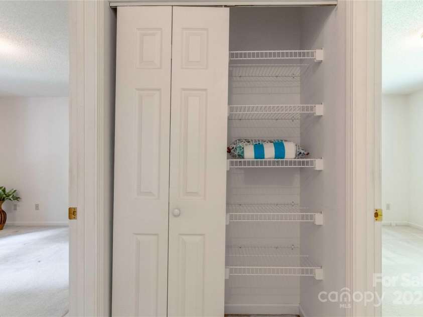 2 Oak Grove Road, Arden, NC 28704.  MLS# CAR4262932, YatesRealty ID 26361. Hall Linen and Hanging Closet