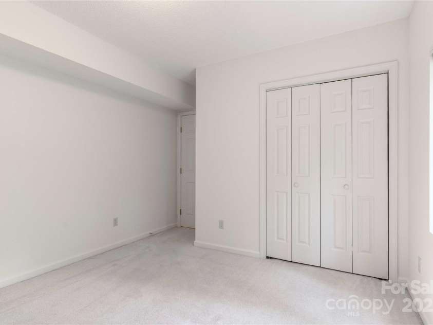 2 Oak Grove Road, Arden, NC 28704.  MLS# CAR4262932, YatesRealty ID 26361. Lower Bedroom with Large Closet