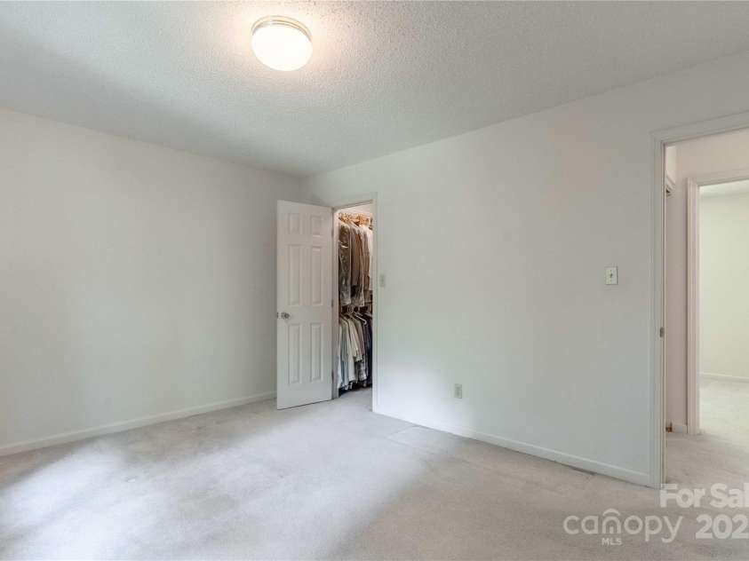 2 Oak Grove Road, Arden, NC 28704.  MLS# CAR4262932, YatesRealty ID 26361. Primary Bedroom with Walk-In Closet