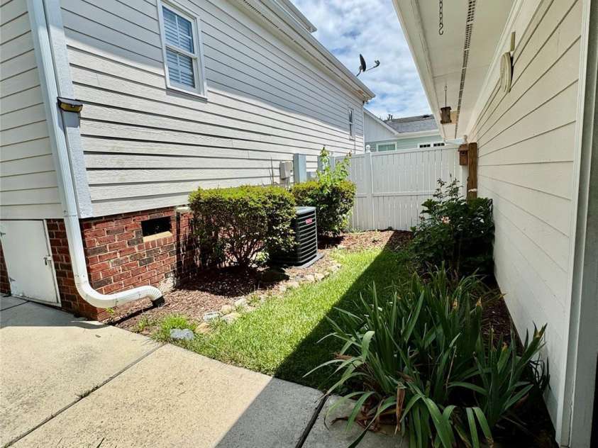 75 Mccurdy Street, Concord, NC 28027.  MLS# CAR4279704, YatesRealty ID 26362. Back area leading to detached garage
