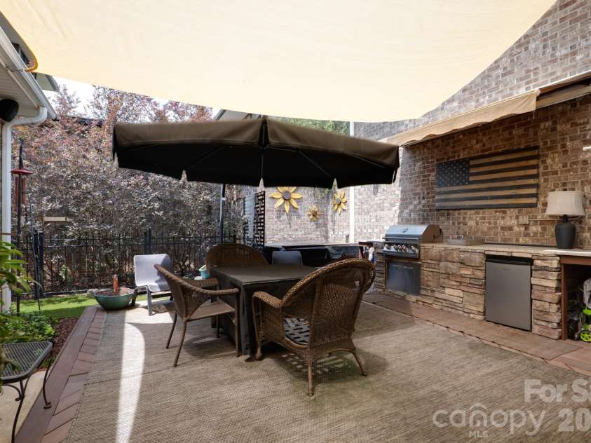 5566 Village Drive, Concord, NC 28027.  MLS# CAR4381902, YatesRealty ID 26364. Enjoy entertaining in this private courtyard