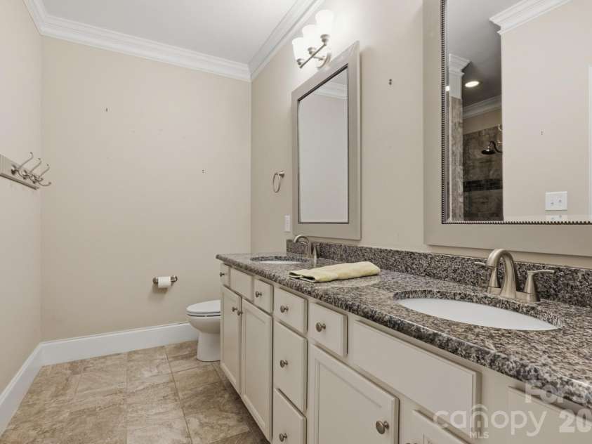 5566 Village Drive, Concord, NC 28027.  MLS# CAR4381902, YatesRealty ID 26364. Primary bath with granite and dual sinks