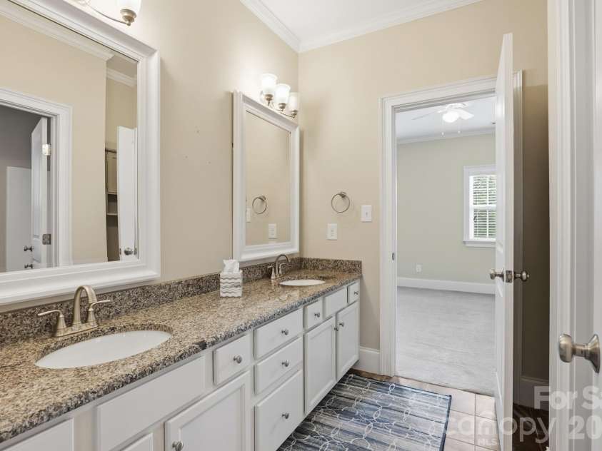 5566 Village Drive, Concord, NC 28027.  MLS# CAR4381902, YatesRealty ID 26364. Upstairs bath with dual sinks