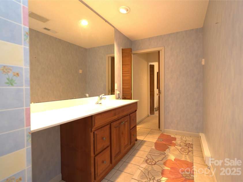 218 McGuffey Ridge Ridge, Gerton, NC 28735.  MLS# CAR4268730, YatesRealty ID 2637. Master bath