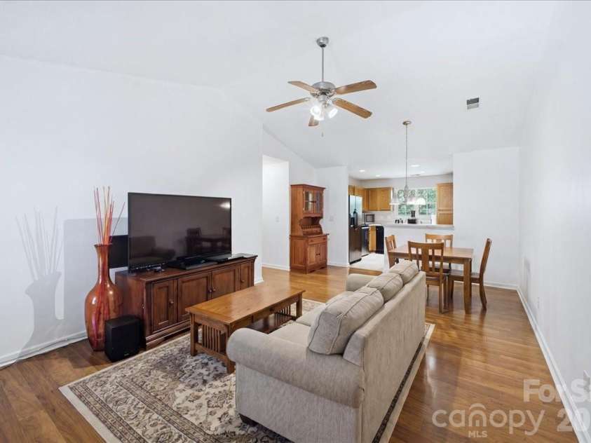 6552 Quarterbridge Lane, Charlotte, NC 28262.  MLS# CAR4386437, YatesRealty ID 26372. Living Rm/Dining Rm (virtually staged)