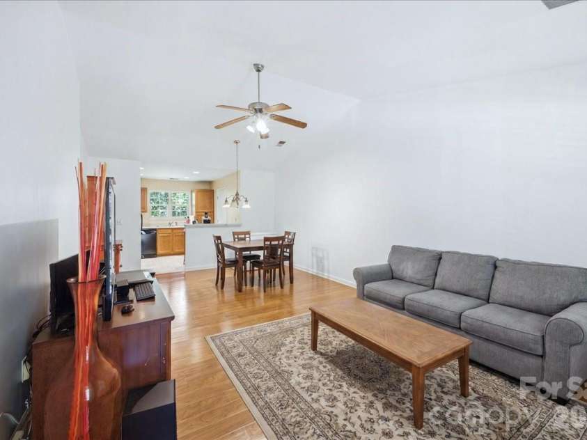 6552 Quarterbridge Lane, Charlotte, NC 28262.  MLS# CAR4386437, YatesRealty ID 26372. Living Rm/Dining Rm (virtually staged)