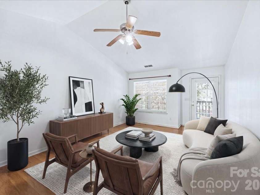 6552 Quarterbridge Lane, Charlotte, NC 28262.  MLS# CAR4386437, YatesRealty ID 26372. Living Room (virtually staged)