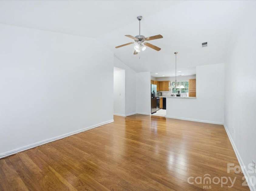 6552 Quarterbridge Lane, Charlotte, NC 28262.  MLS# CAR4386437, YatesRealty ID 26372. Living/Dining rm view to Kitchen