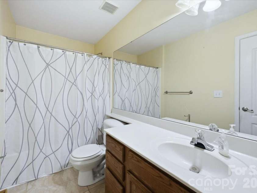 6552 Quarterbridge Lane, Charlotte, NC 28262.  MLS# CAR4386437, YatesRealty ID 26372. Primary Bathroom