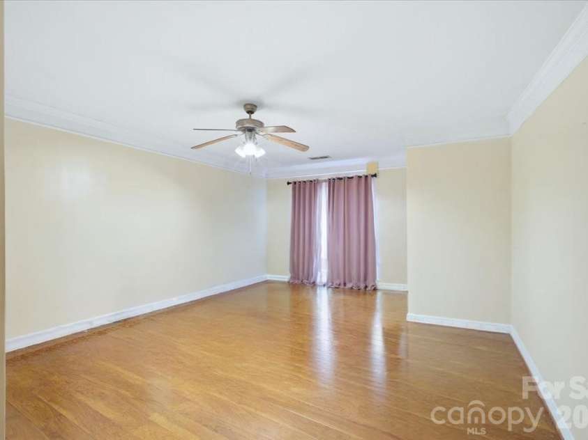 6552 Quarterbridge Lane, Charlotte, NC 28262.  MLS# CAR4386437, YatesRealty ID 26372. Primary Bedroom virtual empty