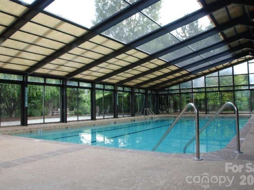 16 Clubside Drive, Asheville, NC 28804.  MLS# CAR4386768, YatesRealty ID 26384. Heated indoor pool